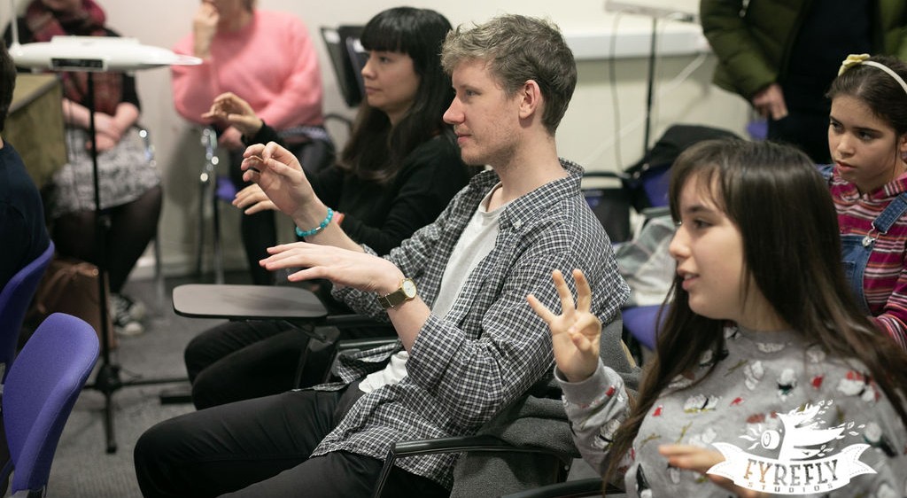 Students learn how to play the theremin, Theremin workshop in Oxford organised by Bate Collection of musical instruments